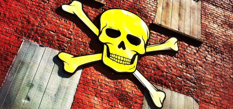 Skull and crossbones on a brick building