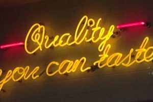 Neon sign saying, 