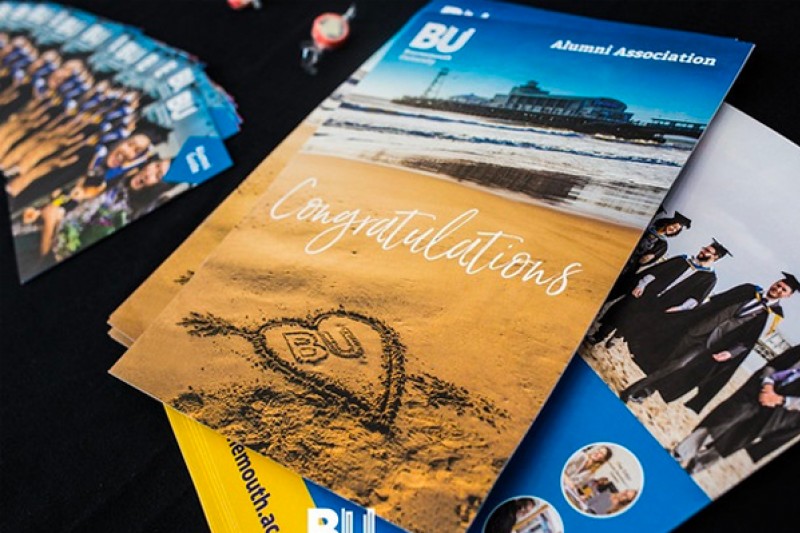 Booklets from the Alumni Association congratulating new graduates