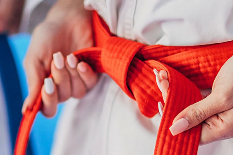 A blue and red karate belt